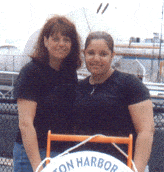 big and little sister in front of boston harbor