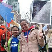 big and little sister at one earth, one climate rally