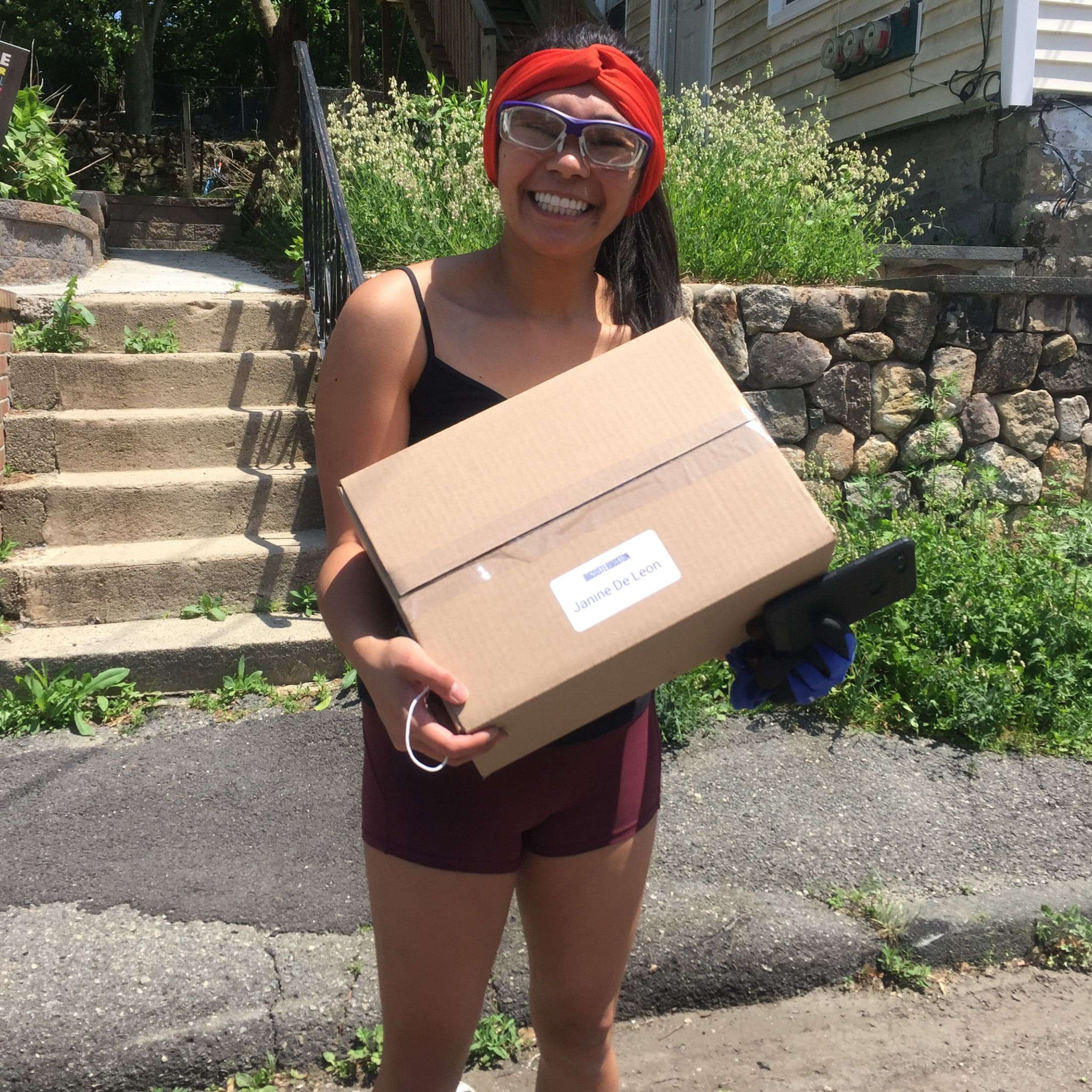 girl holding a cardboard box