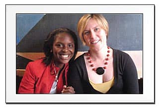 two young women, a big and little sister, smiling together