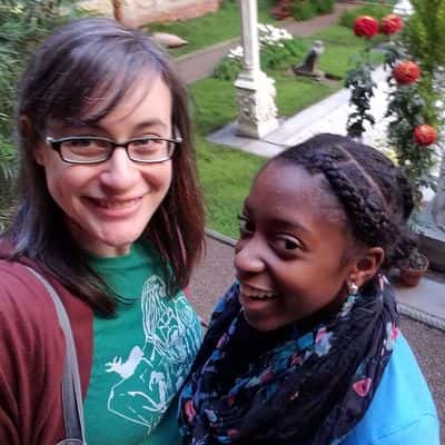 big and little sister taking a selfie together