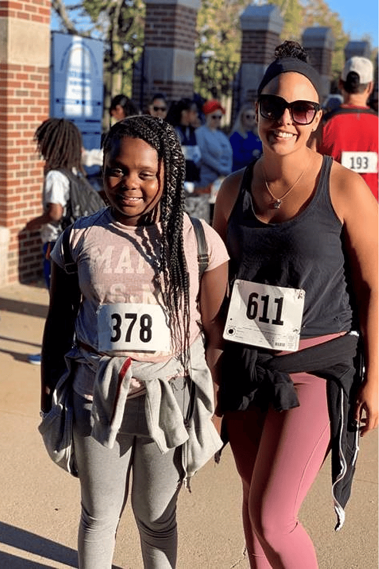 big and little sister participating in a race