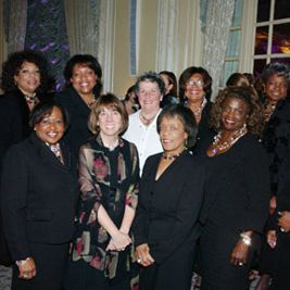 group of women wearing formal outfits at an event