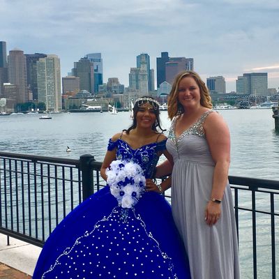 big and little sister celebrating a quinceanera